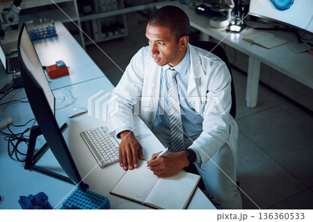 Doctor, writing and night with computer in laboratory for medical research and study with healthcare. Paperwork, male professional and planning with data for biotechnology in clinic or hospital 136360533