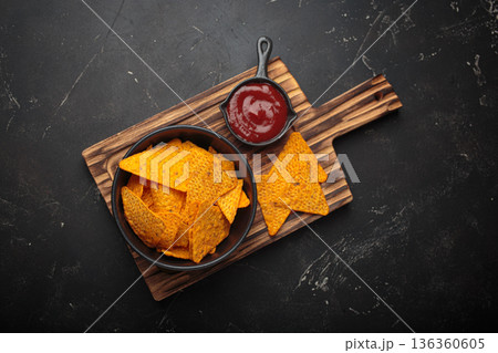 Nachos tortilla chips salsa dip wooden board Mexican Tex-Mex snack fast food 136360605