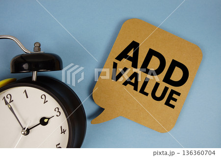 Add Value text with alarm clock on blue background Add Value text with alarm clock on blue background 136360704