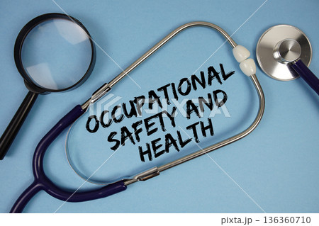 Occupational Safety and Health text with Stethoscope and magnifying glass on blue background 136360710