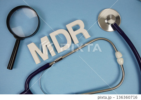 MDR abbreviation of Merchant Discount Rate alphabet letters with magnifying glass and stethoscope on blue background MDR abbreviation of Merchant Discount Rate alphabet letters with magnifying glass and stethoscope on blue background 136360716
