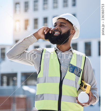 African engineer man, phone call and outdoor with smile, thinking and listen for networking, building or development. Construction site architect, smartphone and idea for property, helmet and contact 136360753