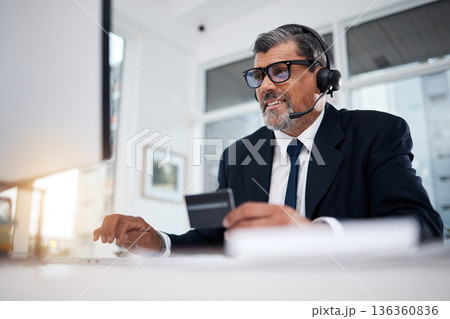 Call center, business man and credit card at computer for financial telemarketing, ecommerce and discount in office. Happy consultant, mature salesman and trading with online banking at desktop pc Call center, business man and credit card at computer for financial telemarketing, ecommerce and discount in office. Happy consultant, mature salesman and trading with online banking at desktop pc 136360836
