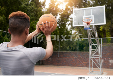 Man, basketball and net outdoor to score points, winning and aim for target from the back. Player, court and athlete prepare to throw ball in hoop for fitness, sports games and competition training Man, basketball and net outdoor to score points, winning and aim for target from the back. Player, court and athlete prepare to throw ball in hoop for fitness, sports games and competition training 136360884