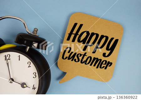Happy Customer text with alarm clock on blue background Happy Customer text with alarm clock on blue background 136360922