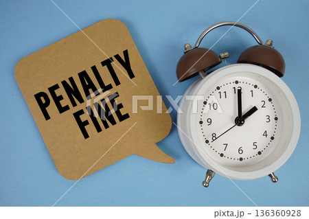 Penalty Fine text with alarm clock on blue background 136360928