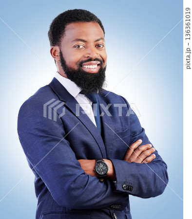 Smile, confidence and portrait of businessman with crossed arms in a studio with success and leadership. Smile, professional and headshot of young, male and African lawyer isolated by blue background 136361019