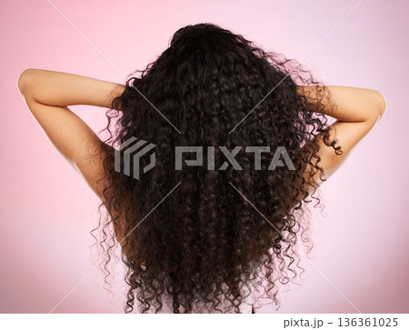 Hair, beauty and back of woman with hairstyle transformation and curly texture. Model, salon treatment and haircut shine in a studio with pink background and cosmetics with keratin and growth care 136361025