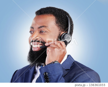 Customer service headset, happy black man and consulting about ecommerce service, help desk advice or contact us. Telemarketing, studio face or African person talking on microphone on blue background Customer service headset, happy black man and consulting about ecommerce service, help desk advice or contact us. Telemarketing, studio face or African person talking on microphone on blue background 136361033