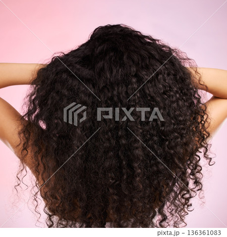 Hair, beauty and back of person with hairstyle transformation and curly texture. Model, salon treatment and haircut shine in a studio with pink background and cosmetics with keratin and growth care 136361083