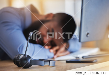 Call center, tired and man sleeping with microphone at desk for burnout, fatigue and low energy in telemarketing office. Closeup, stress and business consultant taking a nap at table in sales agency Call center, tired and man sleeping with microphone at desk for burnout, fatigue and low energy in telemarketing office. Closeup, stress and business consultant taking a nap at table in sales agency 136361117