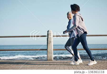 Women, beach and friends running for fitness together as morning exercise for wellness and outdoor bonding. Health, endurance and people training for marathon in Cape Town for sports workout 136361118