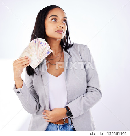 Woman, winner and money in studio from casino, award or cashback payment on white background. Poker, gambling and lady with cash prize from investment, bingo or savings success or financial freedom Woman, winner and money in studio from casino, award or cashback payment on white background. Poker, gambling and lady with cash prize from investment, bingo or savings success or financial freedom 136361162