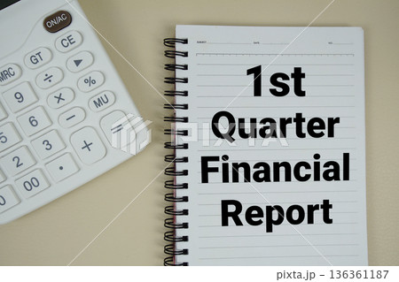 1st Quarter Financial Report text with calculator phrase of business and financial concept 136361187