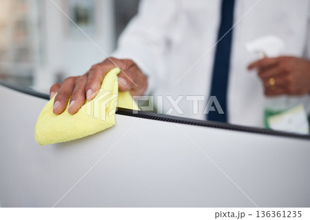 Person, hands and cleaning computer with cloth in office for hygiene, health or safety of virus. Closeup of business worker wipe dirty desktop monitor for sanitation, disinfection or bacteria of dust Person, hands and cleaning computer with cloth in office for hygiene, health or safety of virus. Closeup of business worker wipe dirty desktop monitor for sanitation, disinfection or bacteria of dust 136361235