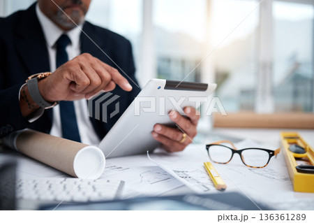 Tablet, hands and architect with research at desk for typing, architecture or planning on internet. Technology, fingers of man and engineer writing, construction design and email for online blueprint 136361289