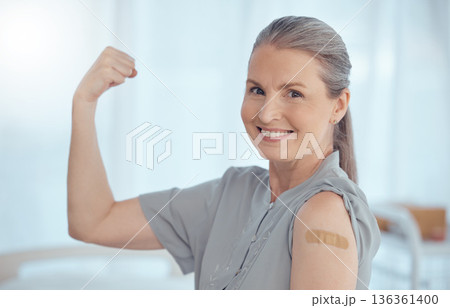 Strong, portrait and a woman with a plaster from a vaccine, healthcare and safety from virus. Happy, muscle and an elderly or senior hospital patient with medical insurance, motivation or vaccination Strong, portrait and a woman with a plaster from a vaccine, healthcare and safety from virus. Happy, muscle and an elderly or senior hospital patient with medical insurance, motivation or vaccination 136361400