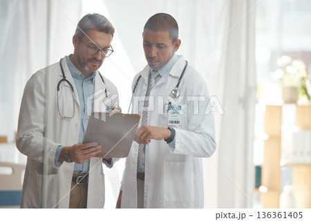 Teamwork, senior or doctors with checklist in hospital meeting or discussion for collaboration together. Leader, help or surgeons talking or speaking of healthcare schedule, report or data analysis Teamwork, senior or doctors with checklist in hospital meeting or discussion for collaboration together. Leader, help or surgeons talking or speaking of healthcare schedule, report or data analysis 136361405