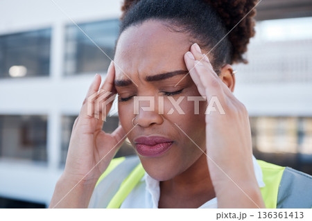 Face, sad and woman in construction with headache at renovation site, civil engineering mistake and stress. Confused, tired and frustrated african contractor with burnout, crisis and problem in city Face, sad and woman in construction with headache at renovation site, civil engineering mistake and stress. Confused, tired and frustrated african contractor with burnout, crisis and problem in city 136361413