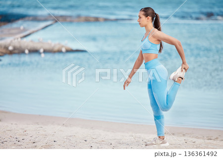 Fitness, sports and woman stretching by beach for wellness, healthy body and balance by sea. Yoga, nature and person stretch legs for exercise, training mockup space and running warm up by ocean 136361492