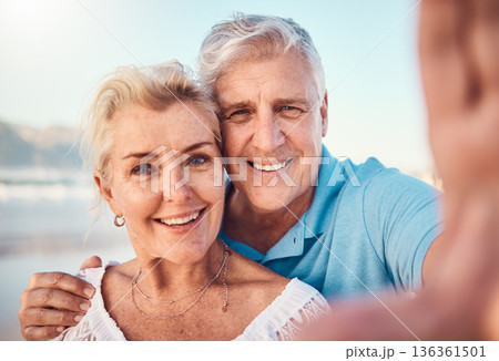 Selfie, smile and old couple on beach for holiday to celebrate love, marriage and memory on social media. Digital photography, senior man and happy woman relax on ocean retirement vacation together. 136361501