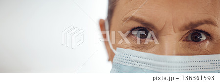 Doctor, portrait and woman with mask, mockup banner and safety in healthcare in hospital on white background. Ppe, face and eyes of medical professional, rules and compliance working in clinic space. Doctor, portrait and woman with mask, mockup banner and safety in healthcare in hospital on white background. Ppe, face and eyes of medical professional, rules and compliance working in clinic space. 136361593