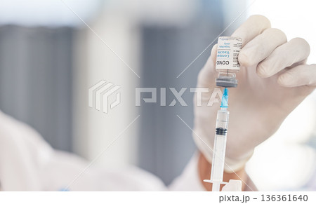 Doctor, hands and syringe for covid vaccine, virus and pharmacy medicine, hospital or clinic service. Medical, compliance or healthcare professional or nurse with needle and corona virus glass bottle Doctor, hands and syringe for covid vaccine, virus and pharmacy medicine, hospital or clinic service. Medical, compliance or healthcare professional or nurse with needle and corona virus glass bottle 136361640