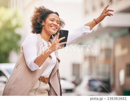 Happy woman, phone and taxi in city for travel, waiting or transportation in street or outdoor road. Female person waving hand for ride service, lift or destination in urban town with smartphone app 136361681