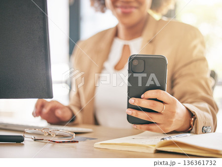 Phone, computer and business woman hands for marketing communication, online planning and social media post. Planner, research and multimedia worker or person typing on mobile for time management job Phone, computer and business woman hands for marketing communication, online planning and social media post. Planner, research and multimedia worker or person typing on mobile for time management job 136361732