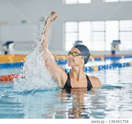 Swimming winner, success or happy woman in celebration for achievement in race or pool competition. Fitness, smile or excited girl swimmer winning sports game with victory or championship performance Swimming winner, success or happy woman in celebration for achievement in race or pool competition. Fitness, smile or excited girl swimmer winning sports game with victory or championship performance 136361756