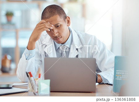 Headache, doctor and man at laptop in medical office with burnout challenge, clinic problem and stress. Frustrated healthcare worker at computer with fatigue, migraine pain and anxiety of 404 mistake 136361808