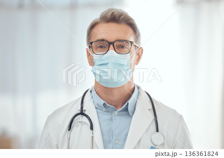 Man, portrait and doctor with face mask in hospital for medical services, surgery and wellness consulting. Male surgeon, mature therapist and healthcare manager working with safety ppe in clinic Man, portrait and doctor with face mask in hospital for medical services, surgery and wellness consulting. Male surgeon, mature therapist and healthcare manager working with safety ppe in clinic 136361824