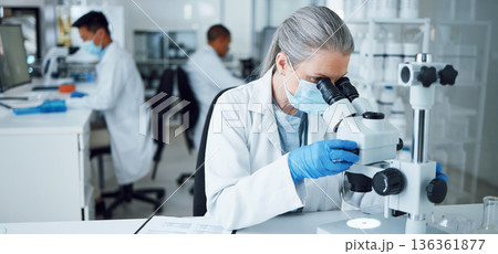 Senior woman, research and lab microscope for info and work for medical analysis. Scientist, investigation and laboratory expert with covid and healthcare report for virus monitoring and data 136361877