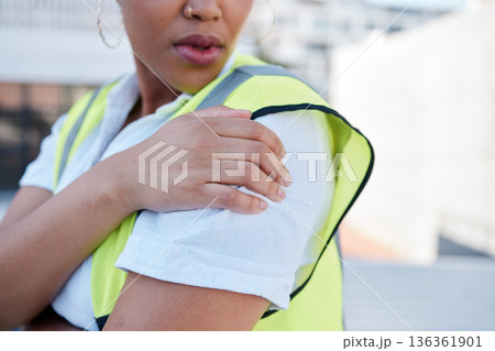 Woman, engineer and hands with shoulder pain outdoor from injury, accident and muscle tension on rooftop. Closeup of female contractor with sore arm, ache and joint inflammation at construction site 136361901