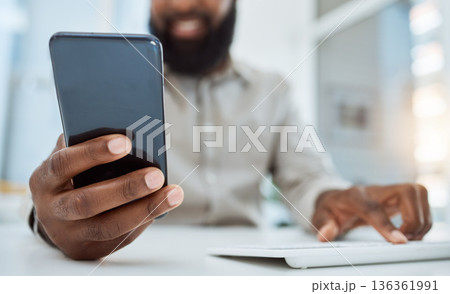 Business man, hands and typing on smartphone at computer in office for social network, mobile website and digital contact. Closeup of worker reading news, notification and app on cellphone at pc desk Business man, hands and typing on smartphone at computer in office for social network, mobile website and digital contact. Closeup of worker reading news, notification and app on cellphone at pc desk 136361991