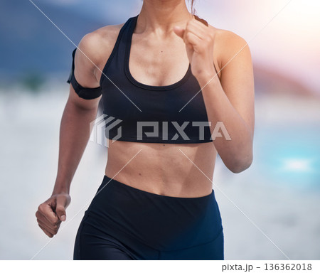 Running, body and woman at a beach for fitness, training and performance, health and workout on blurred background. Sports, wellness and female runner at sea for resilience, challenge or ocean run 136362018