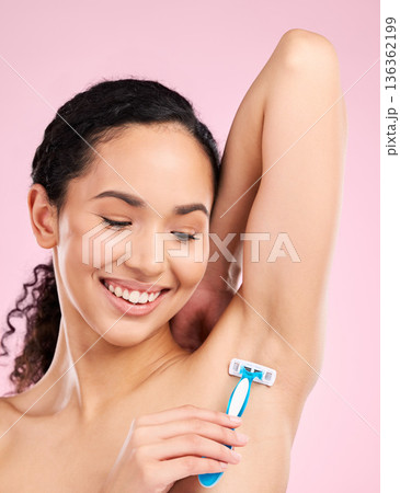 Happy, armpit and a woman shaving for hair removal, beauty and care for body on a studio background. Smile, wellness and a young girl or model with a razor for grooming and hygiene on a backdrop Happy, armpit and a woman shaving for hair removal, beauty and care for body on a studio background. Smile, wellness and a young girl or model with a razor for grooming and hygiene on a backdrop 136362199