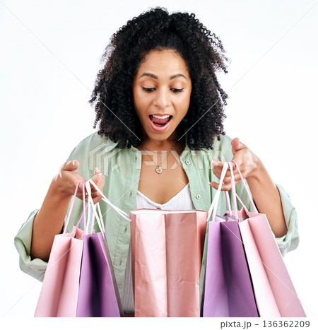 Wow, shopping bag and omg by woman in studio with promotion, deal or giveaway on white background. Retail, sale and female with open mouth shock for present, purchase or cashback sign up store gift 136362209