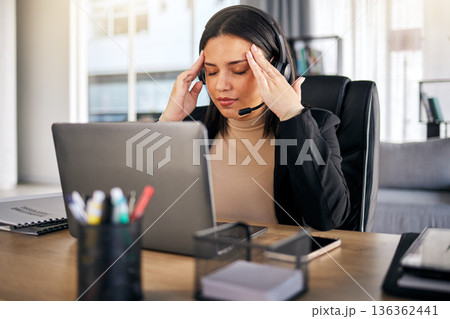 Woman, call center and headache in stress, mistake or client problem on laptop at office desk. Frustrated female person, consultant or agent with bad head pain, anxiety or burnout at the workplace Woman, call center and headache in stress, mistake or client problem on laptop at office desk. Frustrated female person, consultant or agent with bad head pain, anxiety or burnout at the workplace 136362441