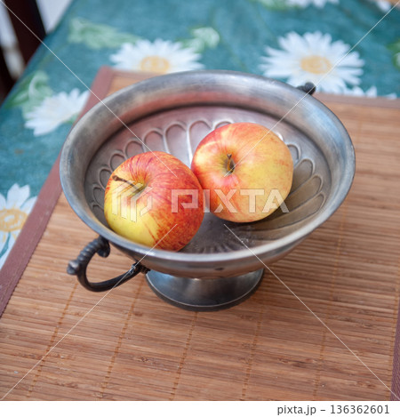 Two Apples in Vase on Table. 136362601