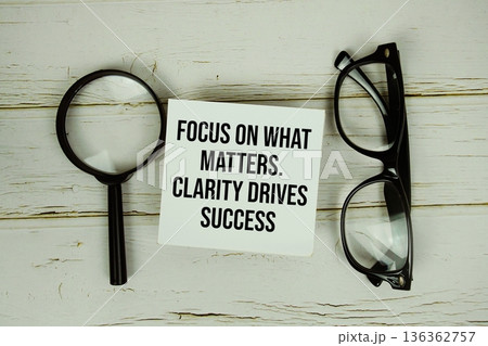 Focus On What Matters. Clarity Drives Success text with eye glasses and magnifying glass on wooden background Focus On What Matters. Clarity Drives Success text with eye glasses and magnifying glass on wooden background 136362757