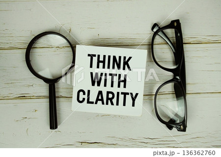 Think With Clarity text with eye glasses and magnifying glass on wooden background Think With Clarity text with eye glasses and magnifying glass on wooden background 136362760