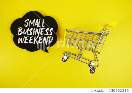Small Business Weekend text with trolley shopping cart on yellow background 136362816