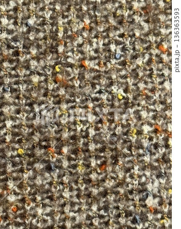 Closeup of textured brown fabric with colorful specks suitable as a textile pattern background Closeup of textured brown fabric with colorful specks suitable as a textile pattern background 136363593