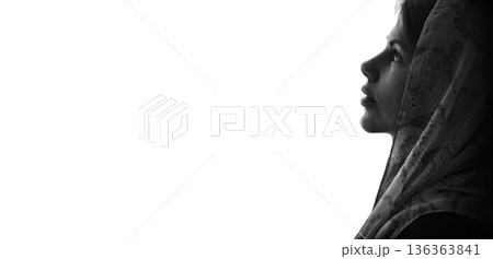 Young girl with bible praying to God 136363841