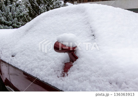 Classic vintage car covered with snow. 136363913