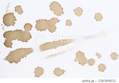 Various prints, blots and stains from spilled black coffee on white paper, top view 136364012