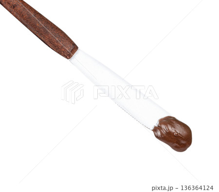 Knife with chocolate cream isolated on white Knife with chocolate cream isolated on white 136364124