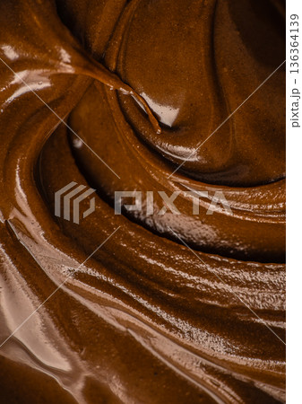 Luxury chocolate spread flowing swirl texture Luxury chocolate spread flowing swirl texture 136364139