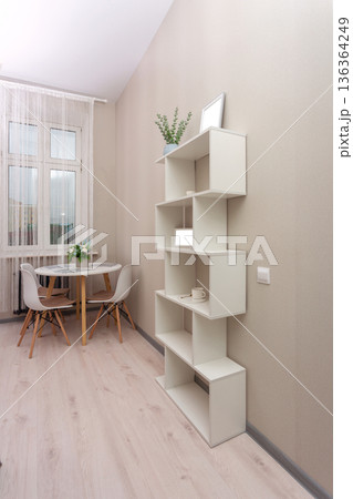 Bright minimalist dining nook with round table and modern chair Bright minimalist dining nook with round table and modern chair 136364249